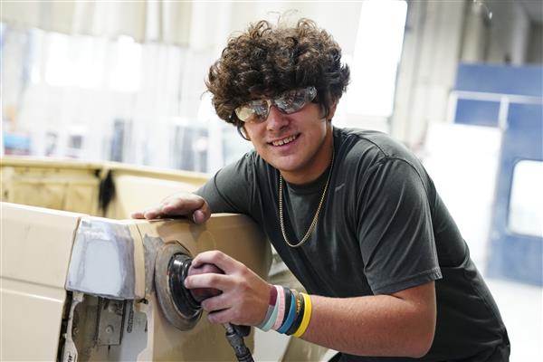 Collision Repair Technology students working on cars